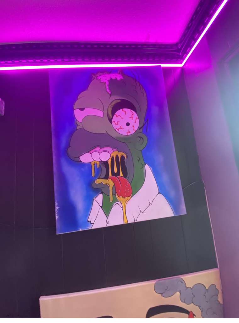 Canvas art lit by magenta neon