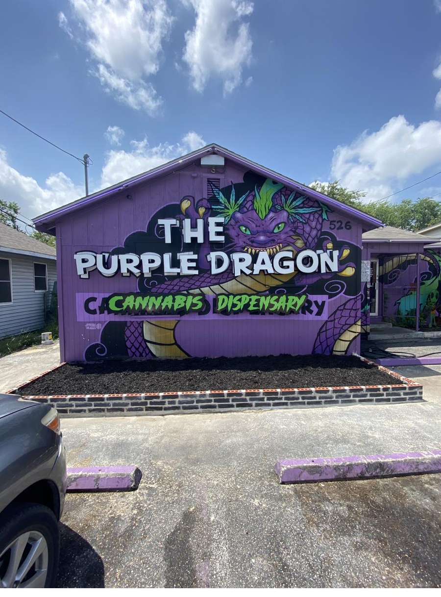 The Purple Dragon storefront mural on 526
